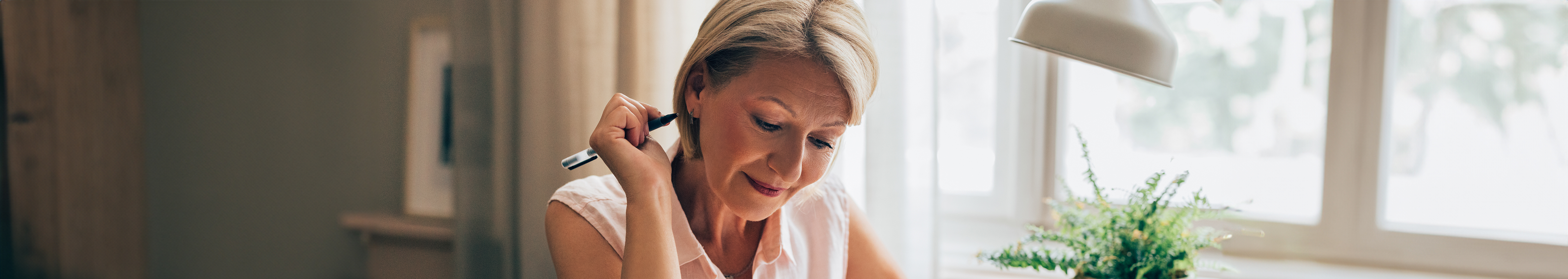 woman with pen prior to breast screen appointment