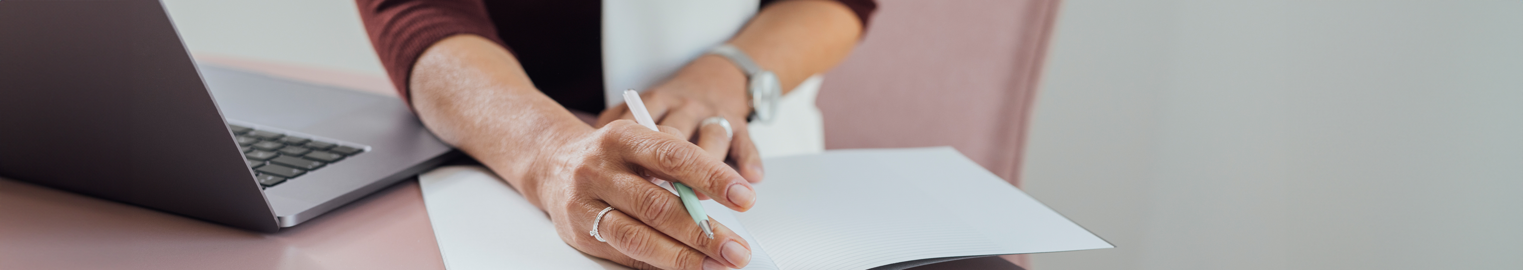 Woman writing on a notebook