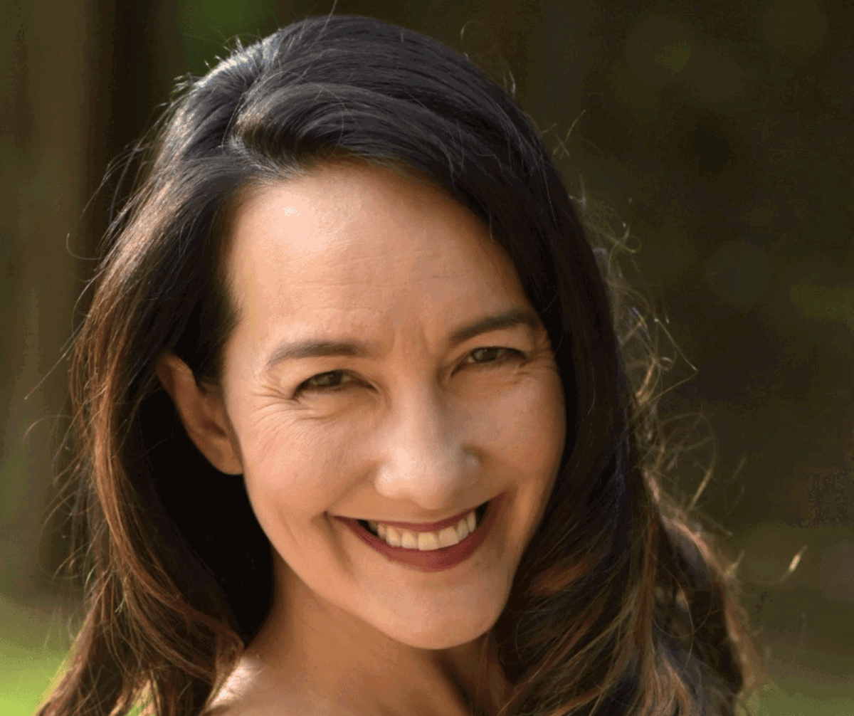 Client testimonial of An who is smiling 