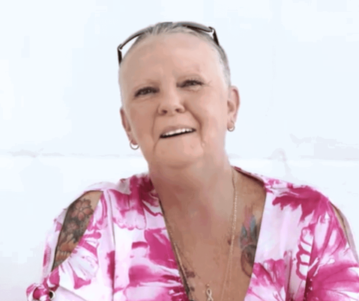 Client testimonial of Debbie who is smiling